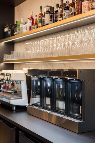 a row of wine glasses sitting on a counter at Vinotel X in Tongeren