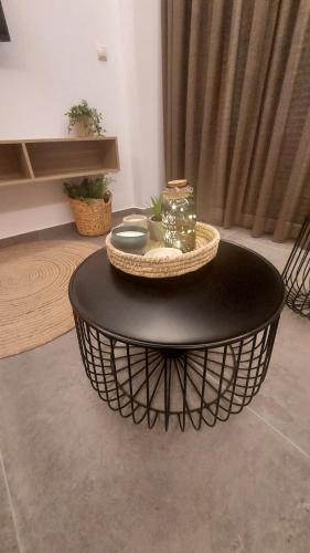 a black coffee table in a living room at Loutraki Hidden Gem IV in Loutraki