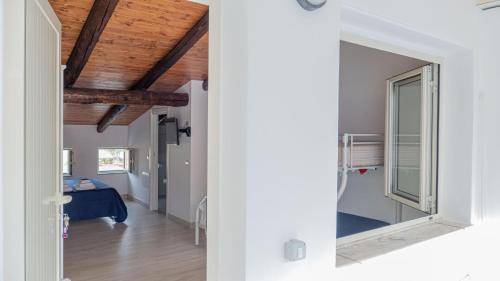 a view from the hallway of a house with a bedroom at Pepi B&B in Santa Maria di Castellabate