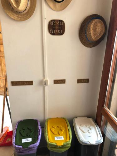 a refrigerator with four colorful bins in a room at House Turi in Ardea