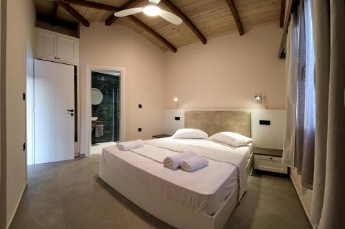 Ліжко або ліжка в номері Villas Meraki
