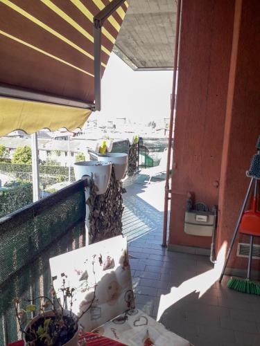 a balcony with a view of the beach and the ocean at BIKE HOUSE "evo" in Seriate
