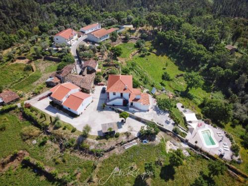 an aerial view of a house with a yard at Quinta Quatro Ventos in Sertã