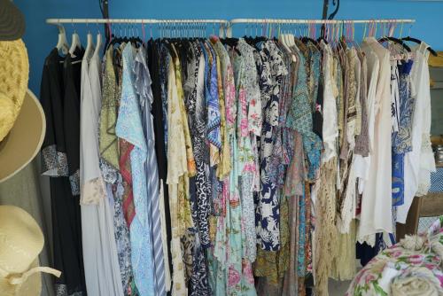 a rack of clothes hanging in a closet at Pacifae Hotel in Katelios