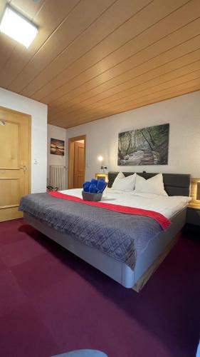 a large bed in a large room with at Pension Pichlerhof in Stall