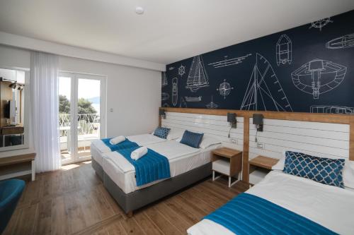 Ένα ή περισσότερα κρεβάτια σε δωμάτιο στο HOTEL IVANDO - K&S