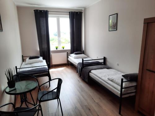 Кровать или кровати в номере Hostel Grębocin