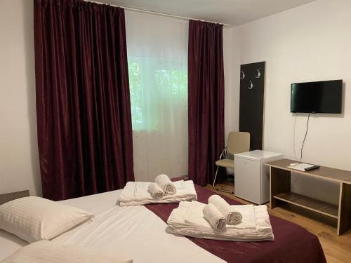 En eller flere senge i et værelse på Vila Ana Trident Costinesti