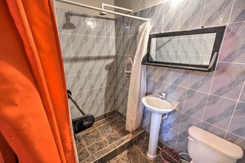 a small bathroom with a toilet and a sink at Guatemala Beachfront Villa with Direct Beach Access! in Monterrico
