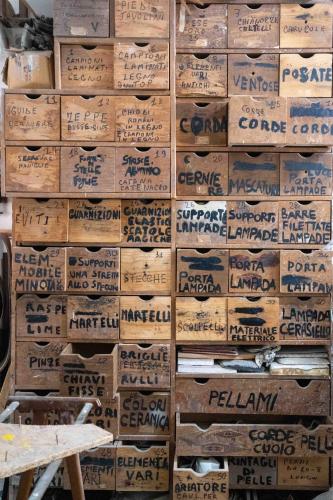 a pile of wooden boxes stacked on top of each other at Atelier Inès Arts & Suites in Naples