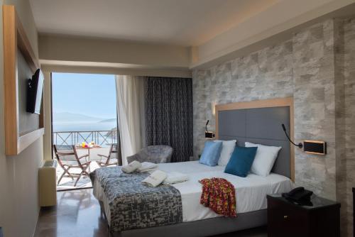Postel nebo postele na pokoji v ubytování King Minos Hotel