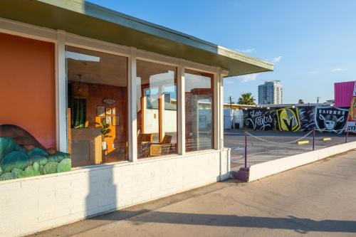 a store front with glass windows on a street at Bungalows Hostel in Las Vegas