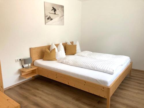 Postel nebo postele na pokoji v ubytování Haus Bazigg