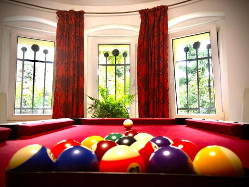 a room with a pool table with balls on it at Jodła i Modrzew Apartament przy Parku i Termach w centrum Uzdrowiska in Jelenia Góra