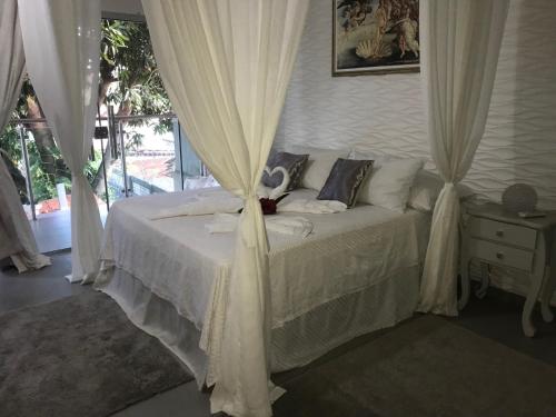 Relais de Charme Boutique Hotel Pititingaにあるベッド