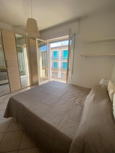 Posteľ alebo postele v izbe v ubytovaní Appartamento nel cuore di Viareggio