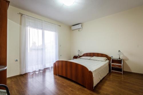 Säng eller sängar i ett rum på Apartments Klara