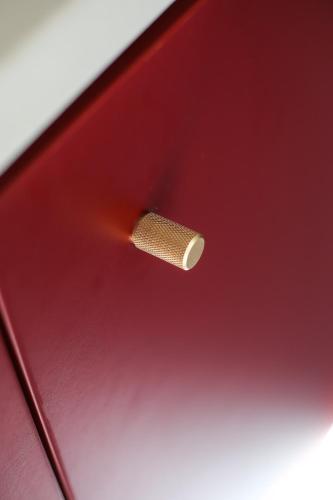 a close up of a screw in a red laptop at Domeček / Tiny House in Český Krumlov