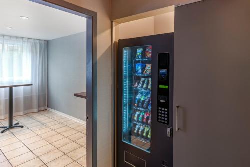 a refrigerator filled with drinks in a hallway at Econo Lodge in Montreal