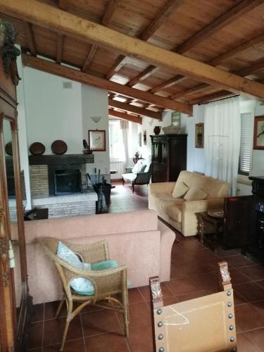 a living room with a couch and a fireplace at Agriturismo Il Casaletto in Montefranco