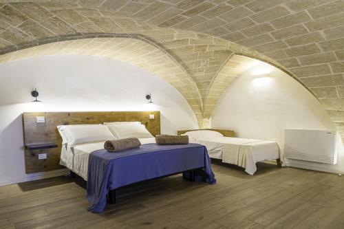 Кровать или кровати в номере Dimora Le Site