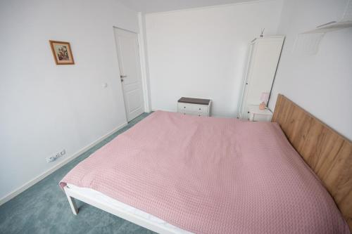 Postel nebo postele na pokoji v ubytování Family Nest Felix