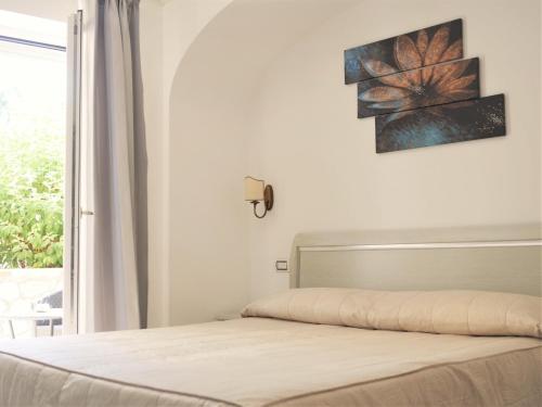 Letto o letti in una camera di Hotel Villa Ceselle
