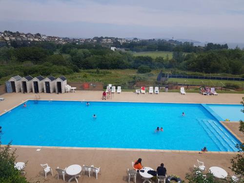 an overhead view of a large swimming pool at Hoburne Devon Holidays Park Sleep 6 Caravan in Paignton