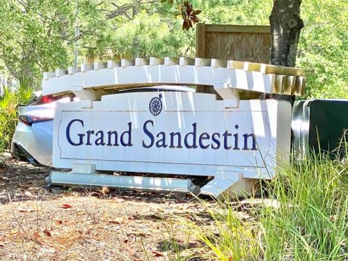 a sign for a grand santasitution on the back of a car at Grand Sandestin at Sandestin Resort by Tufan in Destin