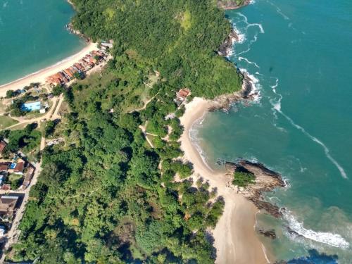 an aerial view of a beach with trees and water at Pousada Refugio do Pirata in Trindade