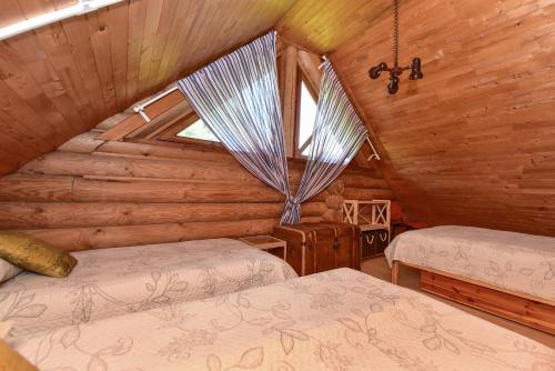 Katil atau katil-katil dalam bilik di Sunny Beaver B&B