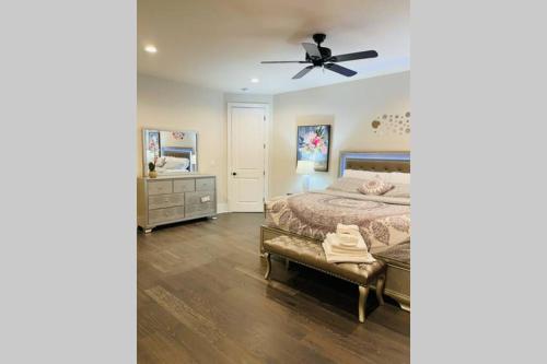 a bedroom with a bed and a ceiling fan at Luxurious Home for Families & Professionals in Mount Holly