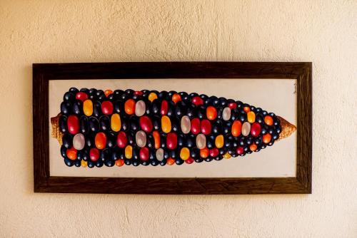 a painting of a fish made out of candy at Casa Palmas by Majikal B&B in Mérida