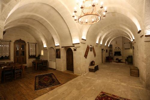 a large room with a chandelier in a building at Kemerli House in Avanos