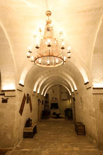 a large chandelier in a hallway in a building at Kemerli House in Avanos