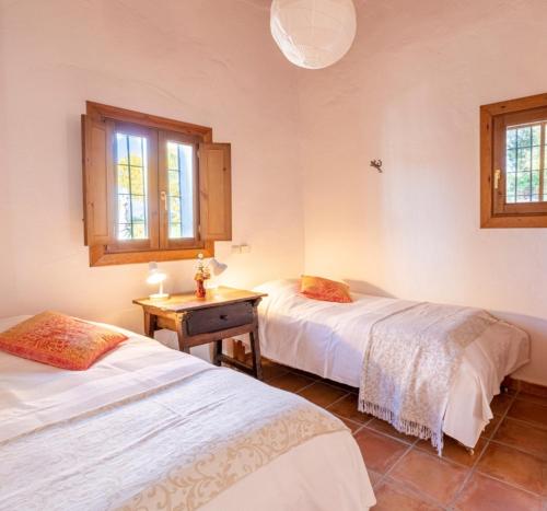 Postel nebo postele na pokoji v ubytování Casa Algarrobo by Rosas Cantares