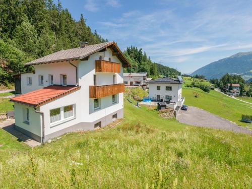 a house in the middle of a field at Holiday home in Wenns Piller with 3 terraces in Piller