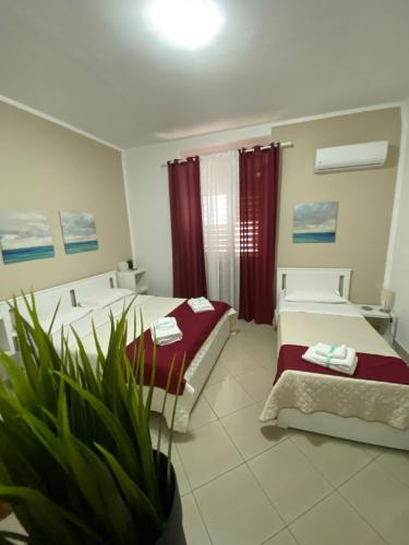 Giường trong phòng chung tại La casa di Palma