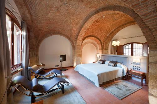 Postel nebo postele na pokoji v ubytování Parador de Caceres