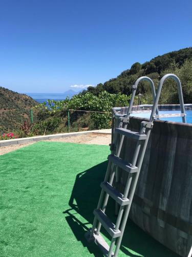 a ladder sitting on the side of a pool at B&B Gàttina in Naso
