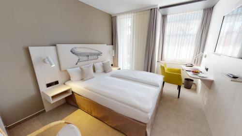 Ein Bett oder Betten in einem Zimmer der Unterkunft Kongresshotel Potsdam am Templiner See