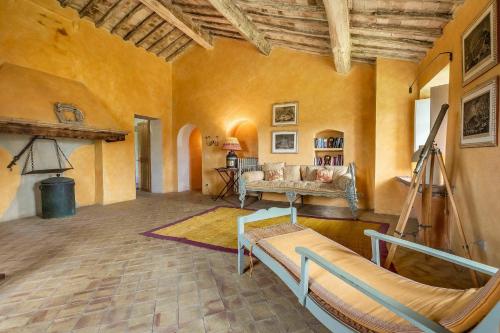 a living room with a couch and a table at Lavacchio 16 by Salogi Villas in Montalcino