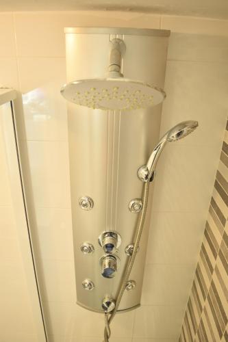 a shower head in a bathroom with a shower at Barbacoa Villaedu in Puebla de Farnals