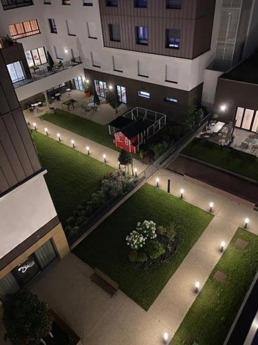 an overhead view of a building with a courtyard with lights at Les Boréales - Appart'hotel & Restaurant in Rouen