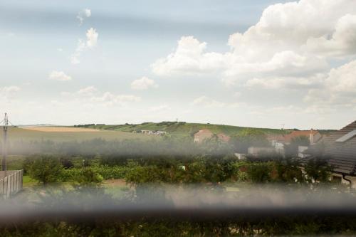 a view from a window of a field with fog at Dětský svět nedaleko Kraví Hory in Bořetice