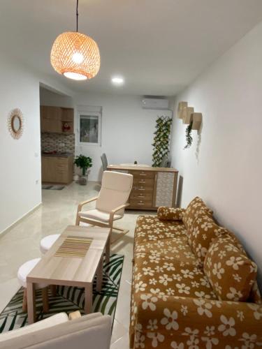 a living room with a couch and a table at Kotor Apartman Green Sailor in Kotor