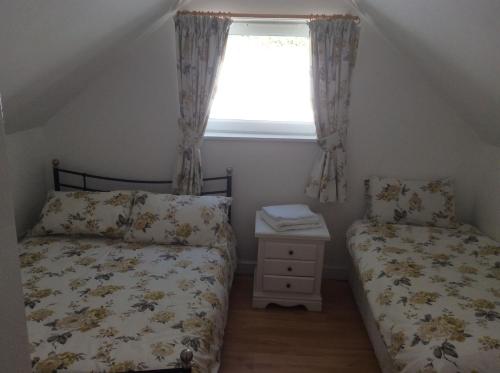 En eller flere senge i et værelse på Charming 3-Bed Cottage Exmoor near Barnstaple