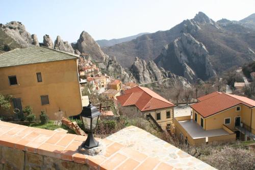 a view of a town with mountains in the background at Monserrat in Castelmezzano