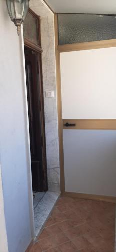 a room with a white door and a doorway at Appartamento Due Camere Magna Graecia in Catanzaro