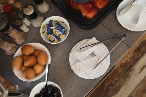 a table topped with bowls of eggs and other foods at Villa Pino in Velingrad